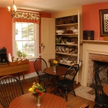 red room with tables and chairs